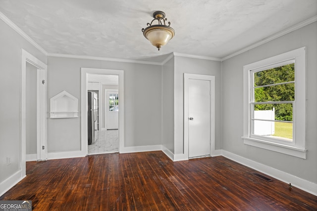 unfurnished room featuring crown molding and dark hardwood / wood-style flooring