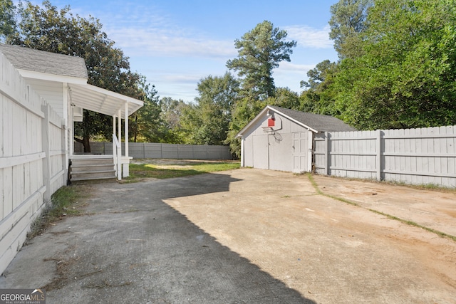 view of patio / terrace with a storage shed