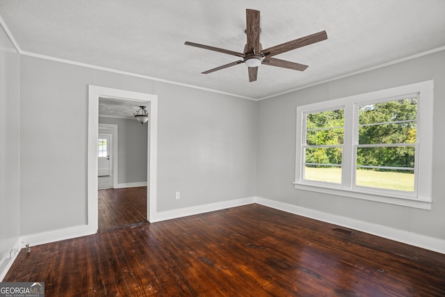 unfurnished room with ceiling fan, ornamental molding, a textured ceiling, and dark hardwood / wood-style flooring