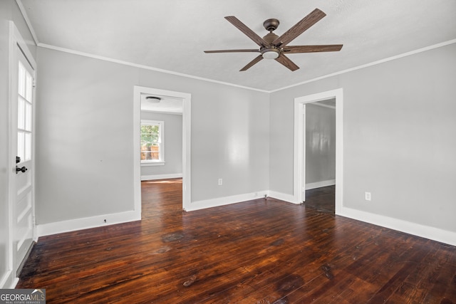 unfurnished room featuring crown molding, ceiling fan, and dark wood-type flooring