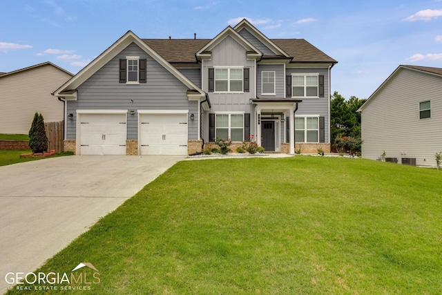 craftsman-style house featuring a front yard and a garage