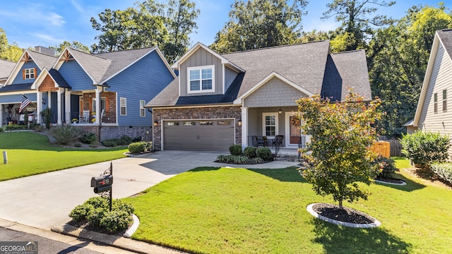 craftsman-style house featuring a porch, a garage, and a front yard