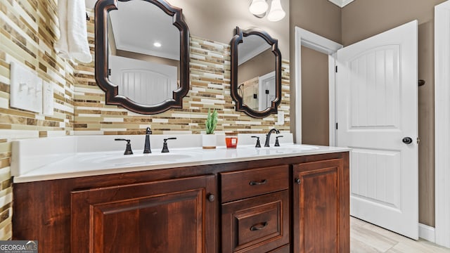 bathroom with tasteful backsplash and vanity