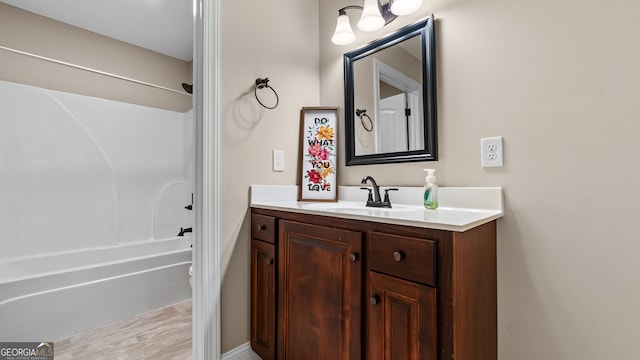 bathroom featuring vanity and washtub / shower combination