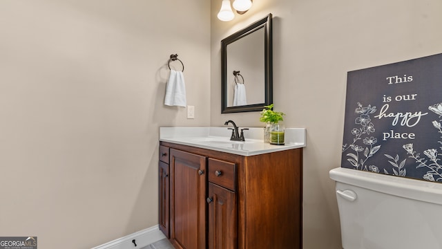 bathroom with vanity and toilet