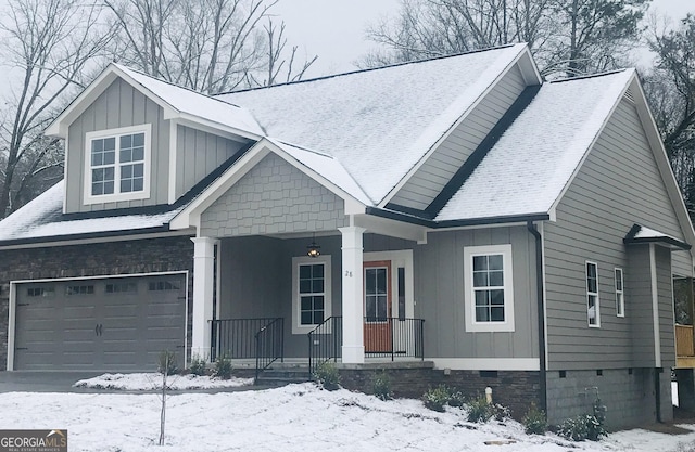 view of front of home featuring a garage and covered porch