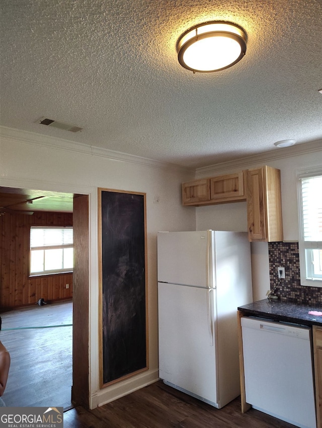 kitchen with light brown cabinets, ornamental molding, dark hardwood / wood-style floors, white appliances, and backsplash