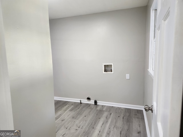 laundry room with washer hookup, hookup for a gas dryer, and light hardwood / wood-style floors