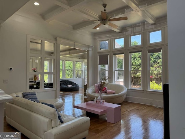empty room with crown molding, carpet, a ceiling fan, baseboards, and a tray ceiling