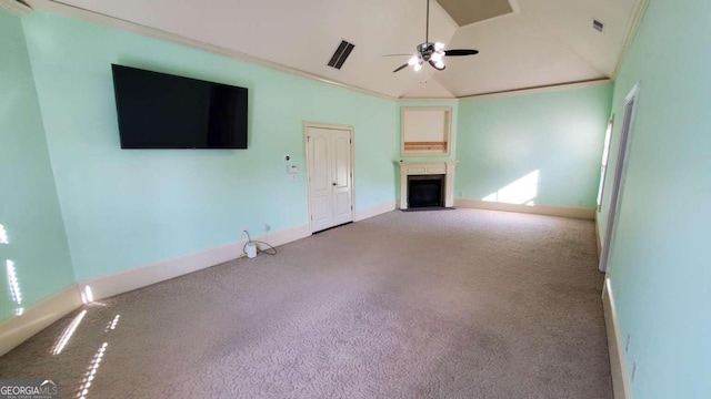 unfurnished living room featuring crown molding, carpet, vaulted ceiling, and ceiling fan