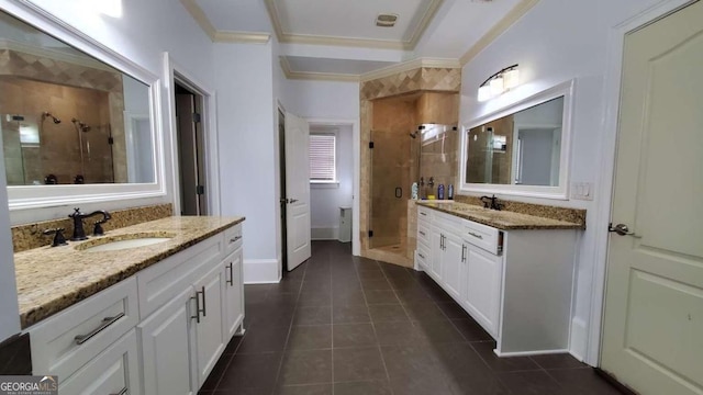 bathroom with vanity, tile patterned floors, ornamental molding, and walk in shower