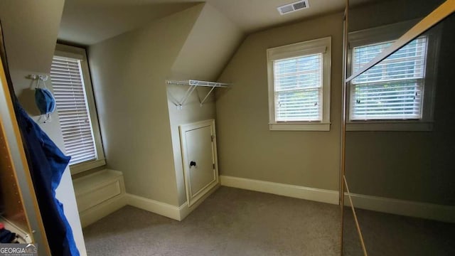 laundry area featuring light colored carpet