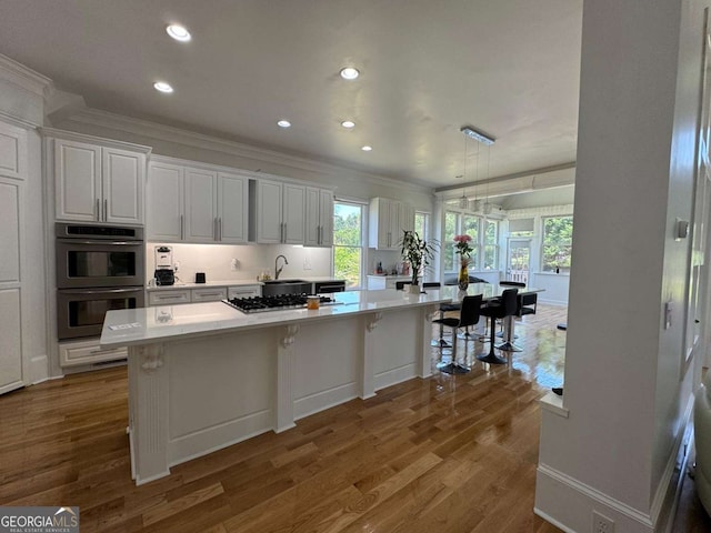 laundry room with carpet flooring, baseboards, and visible vents