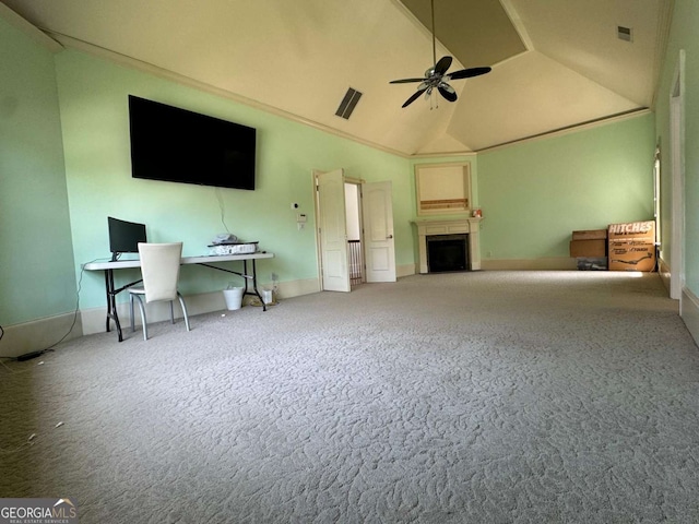 living room with a ceiling fan, visible vents, a fireplace, vaulted ceiling, and carpet flooring
