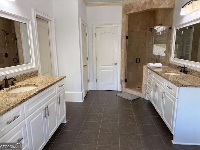 full bath featuring a sink, tile patterned floors, and a stall shower