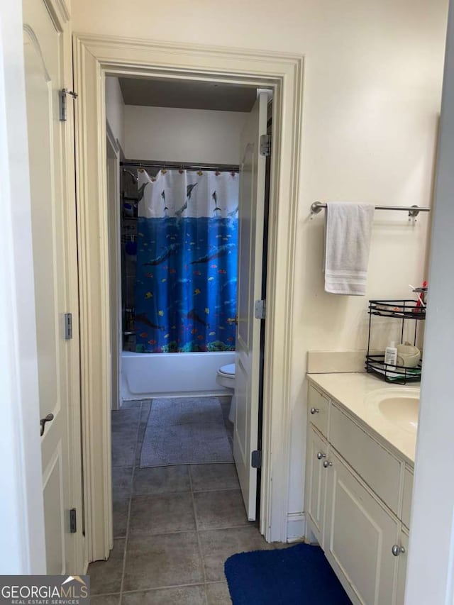 full bathroom with tile patterned floors, shower / tub combo, and vanity