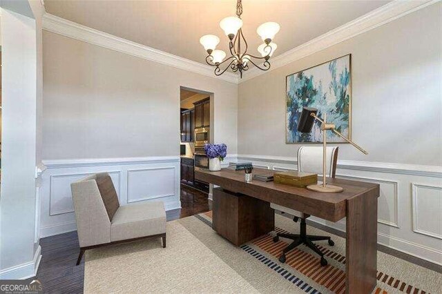 office space with ornamental molding, hardwood / wood-style flooring, and a chandelier