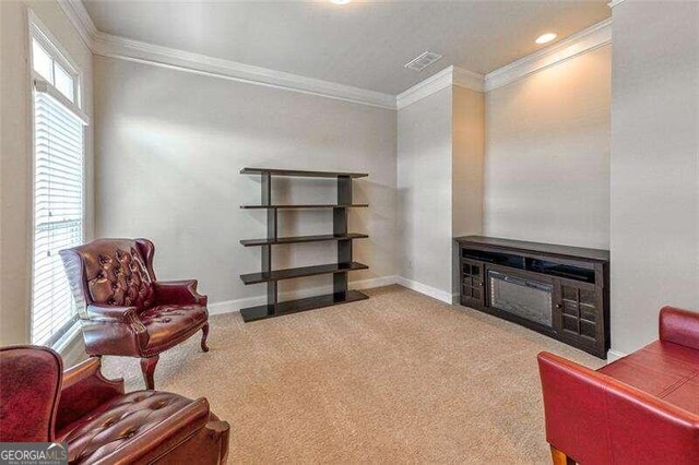 living area with light carpet and crown molding