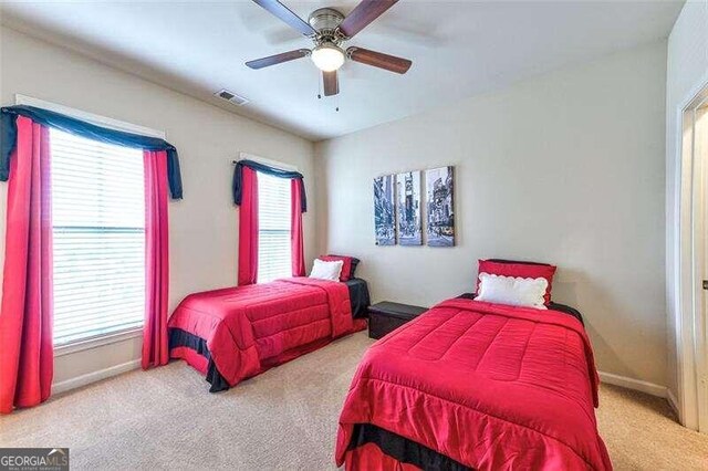 bedroom with ceiling fan and carpet