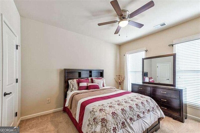 carpeted bedroom with ceiling fan