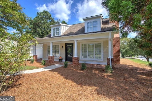 cape cod-style house with a porch