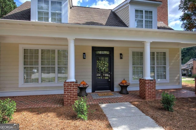 doorway to property with a porch