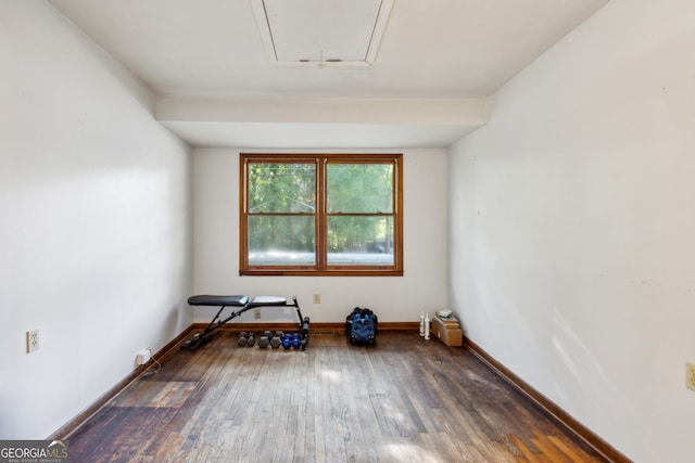 unfurnished room with dark hardwood / wood-style floors