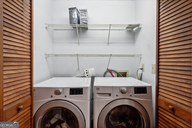 washroom featuring washer and dryer