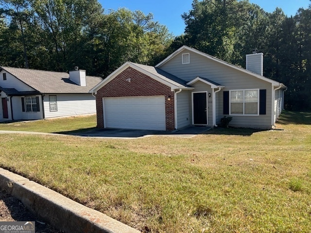 view of front facade featuring a front lawn and a garage