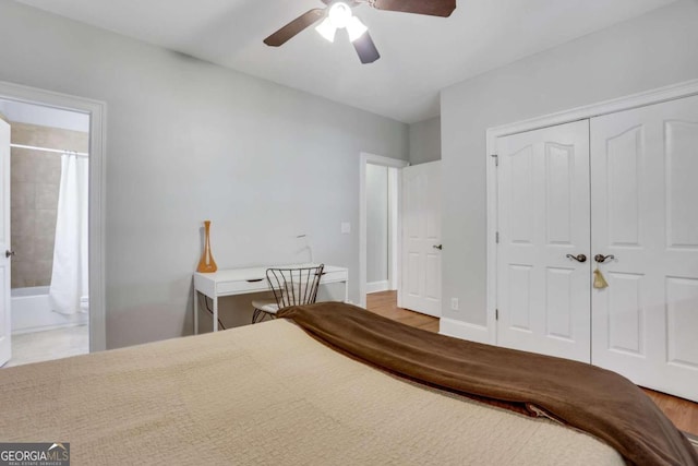 bedroom featuring ceiling fan, a closet, connected bathroom, and light hardwood / wood-style floors