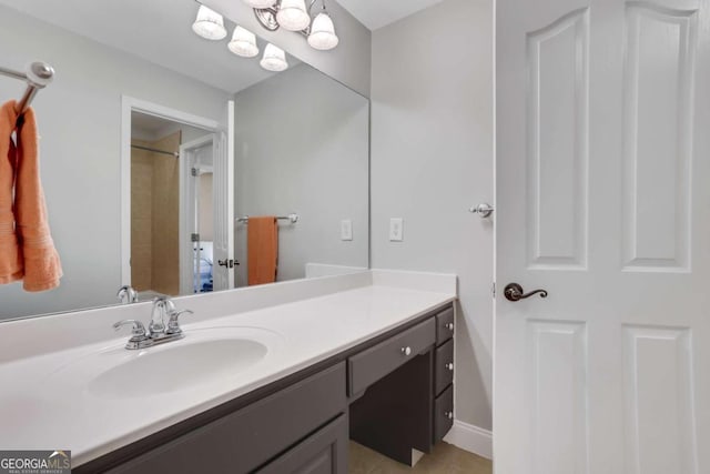 bathroom with curtained shower, vanity, and tile patterned floors