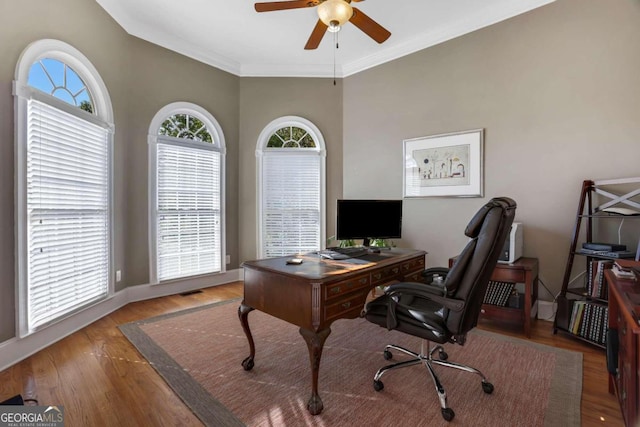 office area with ornamental molding, ceiling fan, and wood-type flooring