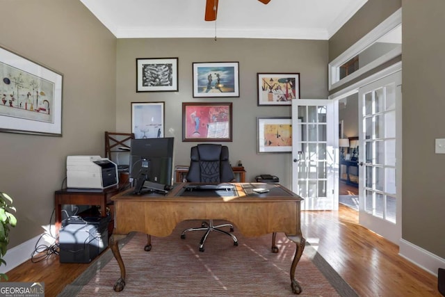 office space with french doors, hardwood / wood-style flooring, ornamental molding, and ceiling fan