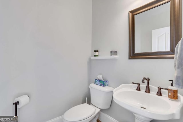 bathroom with sink and toilet