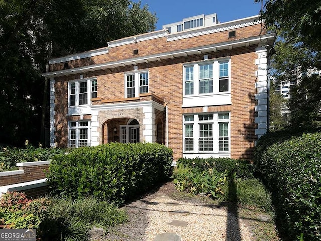 view of front of home with brick siding