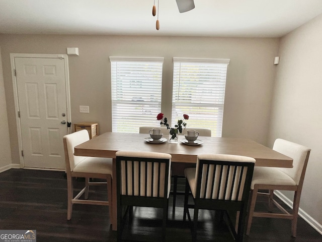 dining room featuring dark hardwood / wood-style flooring and ceiling fan