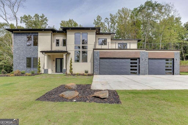 view of front of house featuring a balcony, a front yard, and a garage