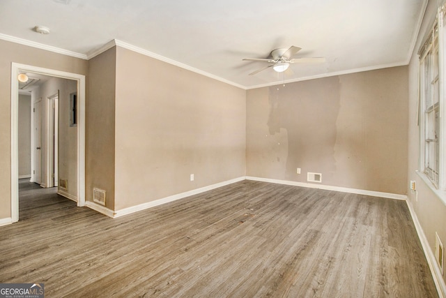 spare room with crown molding, hardwood / wood-style flooring, and ceiling fan