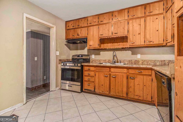 kitchen with light tile patterned flooring, dishwasher, sink, and stainless steel gas stove