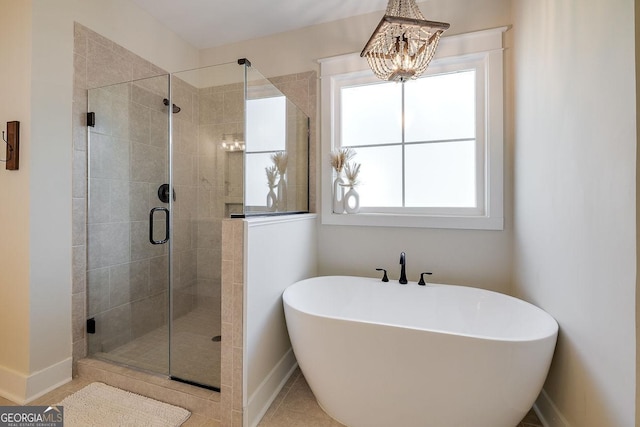 205 Park Chase, Pooler, GA 31322 - bathroom with a soaking tub, a shower stall, baseboards, and a chandelier