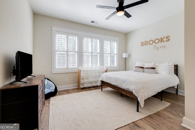 bedroom featuring wood-type flooring and ceiling fan