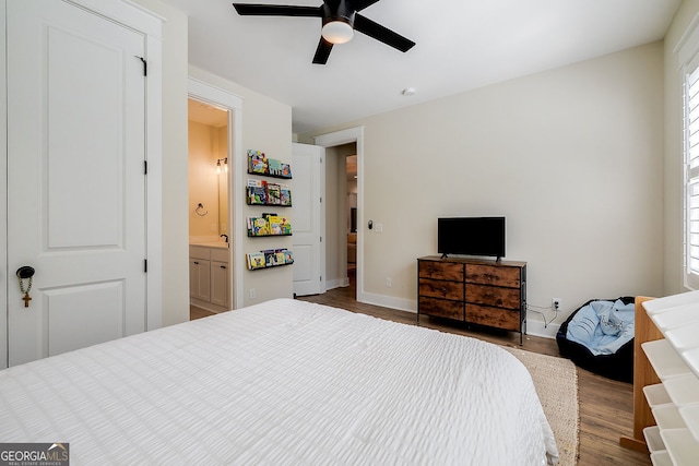 bedroom with connected bathroom, ceiling fan, and hardwood / wood-style flooring