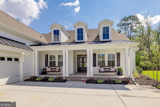 205 Park Chase, Pooler, GA 31322 - view of front facade featuring a porch, a standing seam roof, french doors, concrete driveway, and metal roof