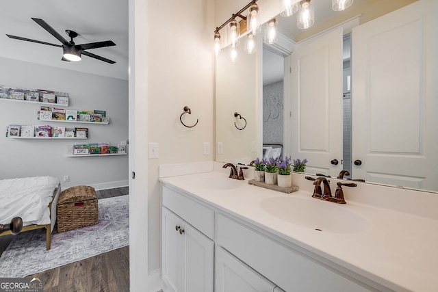 bathroom featuring vanity, hardwood / wood-style flooring, and ceiling fan