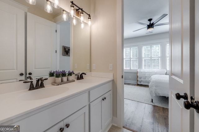 bathroom featuring vanity, hardwood / wood-style flooring, and ceiling fan