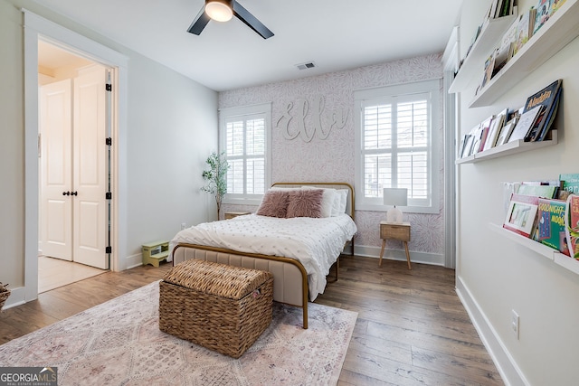 bedroom featuring hardwood / wood-style flooring and ceiling fan