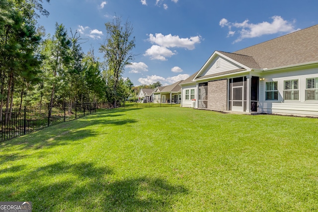 view of yard featuring a sunroom