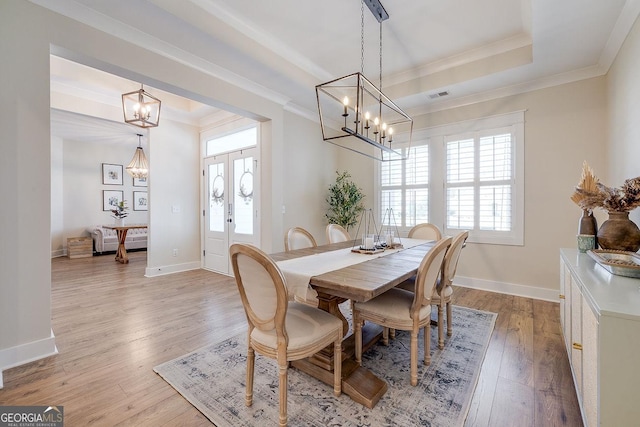 205 Park Chase, Pooler, GA 31322 - dining space with a chandelier, ornamental molding, light wood-style floors, baseboards, and a tray ceiling