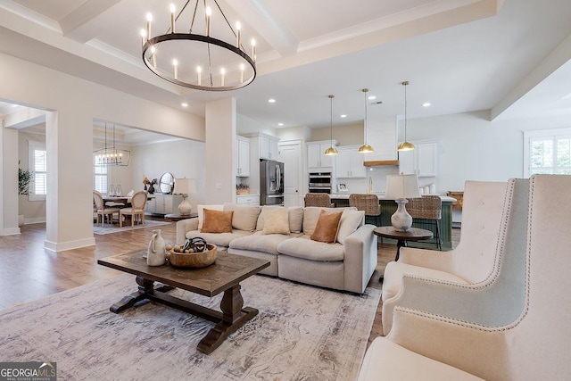 205 Park Chase, Pooler, GA 31322 - living room featuring a chandelier, beam ceiling, light wood-type flooring, recessed lighting, and baseboards