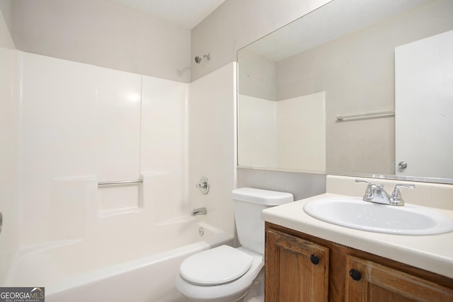 full bathroom featuring a textured ceiling, vanity, toilet, and shower / bathtub combination